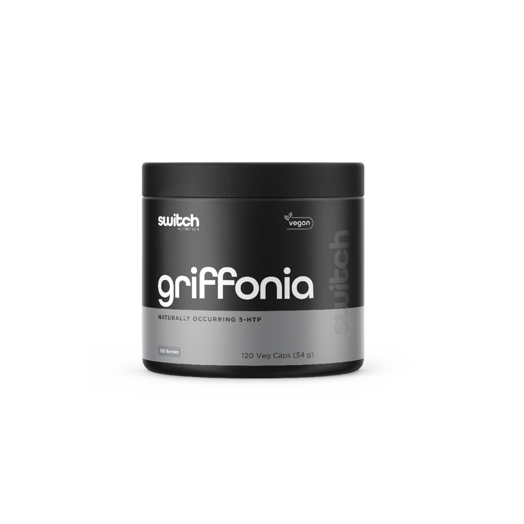 A container of Switch Nutrition Griffonia, a vegan product containing naturally occurring 5-HTP, with 120 vegetable capsules amounting to 54 grams in total, displayed alongside two white capsules in front of the container.