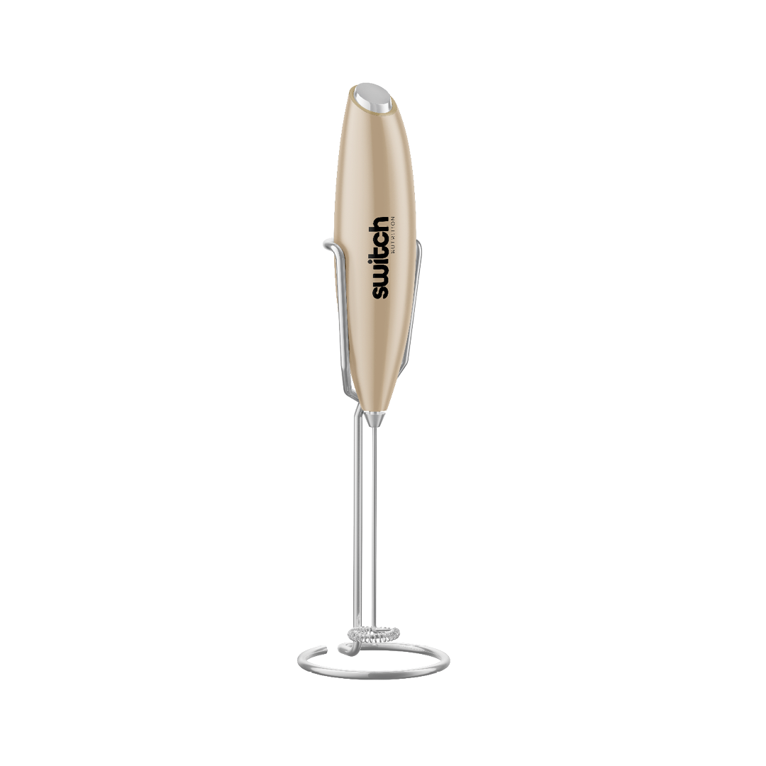 Switch Nutrition Whiz Stick Hand Blender (Beige): A sleek, beige hand blender with the Switch Nutrition logo, displayed in a stand.