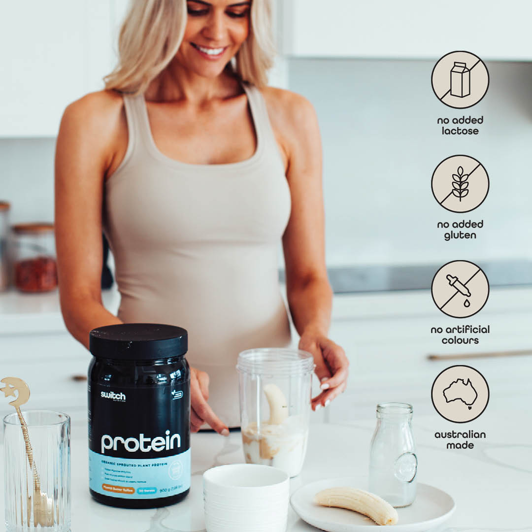 Woman in a beige tank top preparing a smoothie with Switch Nutrition Protein, bananas, and a milk bottle, with four product benefit icons